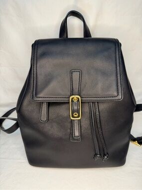 Coach 9858 Legacy black leather backpack featuring gold-tone brass hardware.